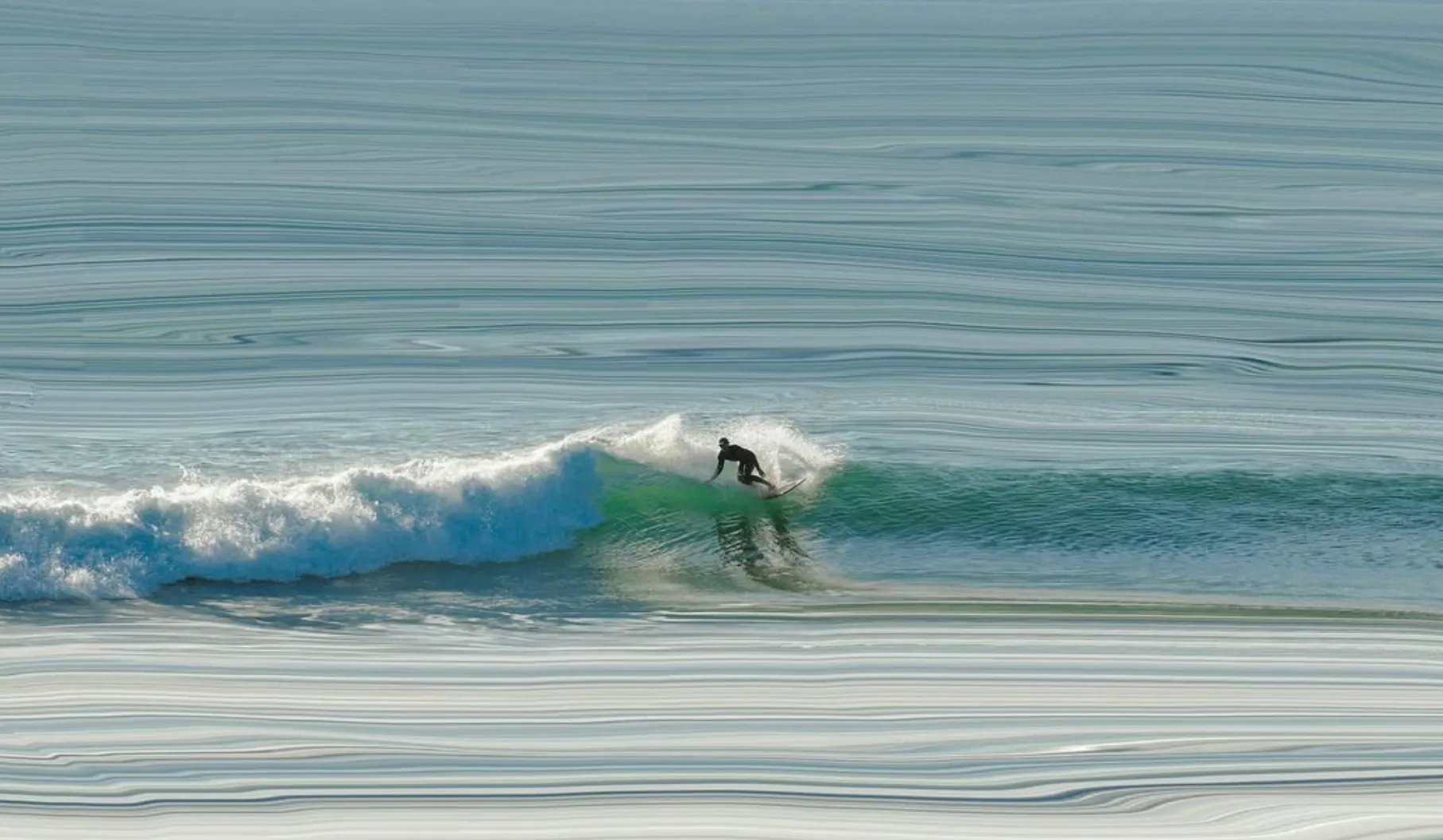 Surfing Flynns Beach
